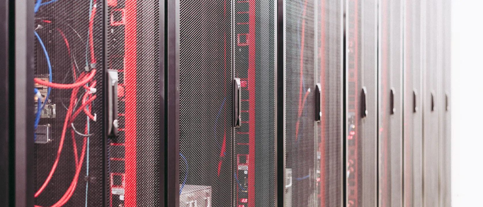 Rows of server racks with structured cabling in a data centre
